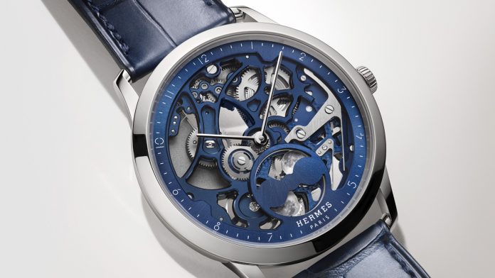 hermes Slim d’Hermès Squelette Lune: reloj de alta relojería con esfera calada, fases lunares y movimiento manufactura Hermès H1953 en titanio o platino.